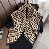 Tan and black geometric monogram print silk scarf with black border