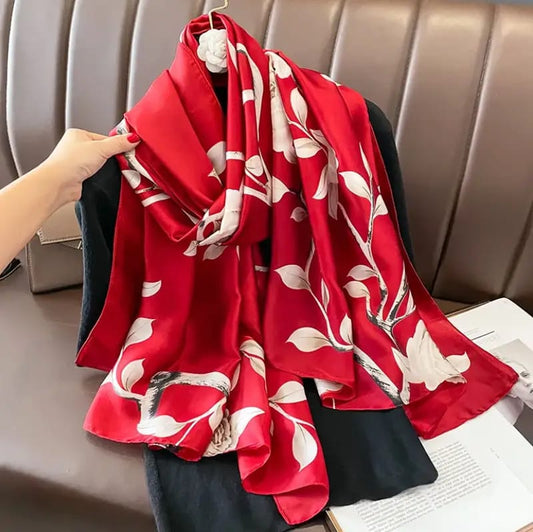 Crimson red silk-satin scarf with elegant white botanical leaf and floral print